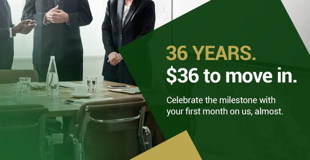 Barrister Suites Office Lease Three people in business attire stand by a conference table with water bottles and glasses. Text overlay reads: “36 YEARS. $36 to move in. Celebrate the milestone with your first month on us, almost.”.