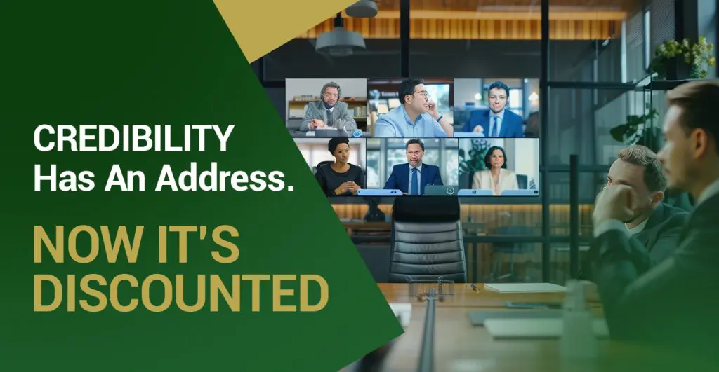 Barrister Suites Office Lease A group of businesspeople in a conference room participate in a video call with colleagues on a large screen. Text on the image reads, CREDIBILITY Has An Address. NOW ITS DISCOUNTED in bold letters.