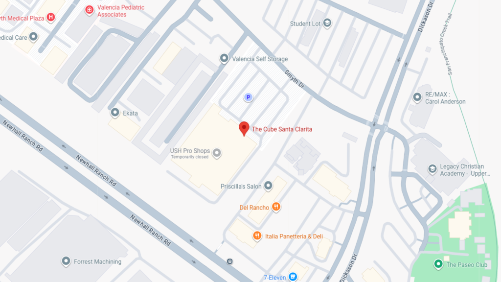 Map showing The Cube Santa Clarita location with a red pin near Newhall Ranch Rd and Snyth Dr in a shopping/commercial complex area.