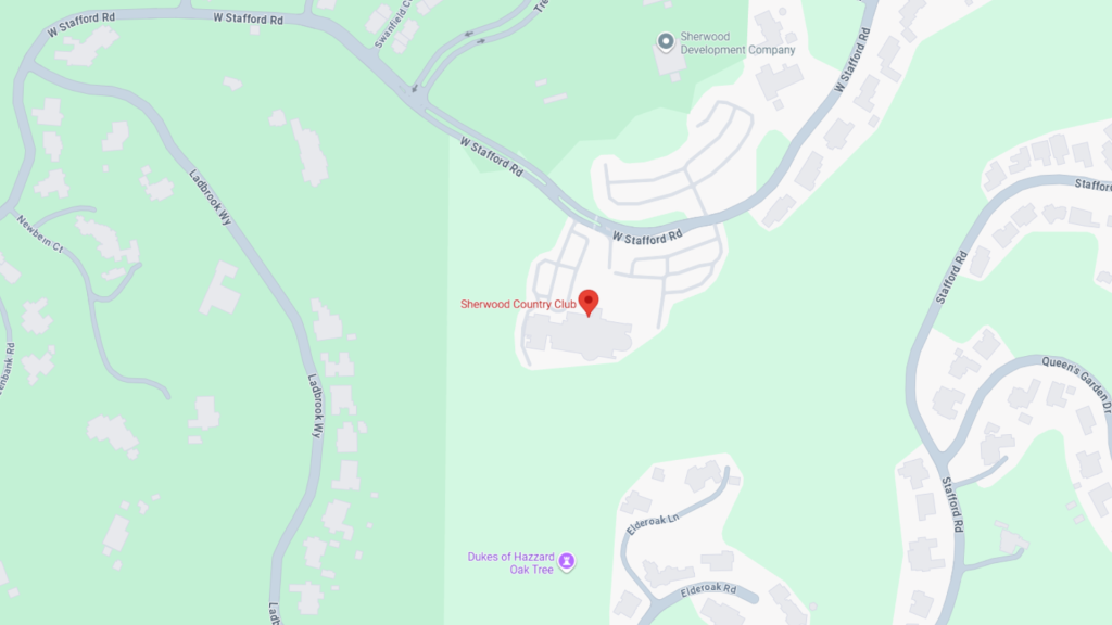 Barrister Suites Office Lease Map showing the location of Sherwood Country Club, marked with a red pin, surrounded by residential streets and green areas, including Dukes of Hazzard Oak Tree to the south. Nearby roads include W Stafford Rd and Ladbrook Way.