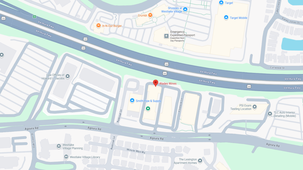 Top-down map showing the Ventura Freeway (101) with a red pin marking Wades Wines near Canwood Street, surrounded by stores and office buildings.