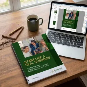 Barrister Suites Office Lease A spiral-bound workbook titled “Start Like a Real Business” lies on a wooden desk next to a cup of coffee, pen, notebook, and an open laptop displaying the same workbook cover.