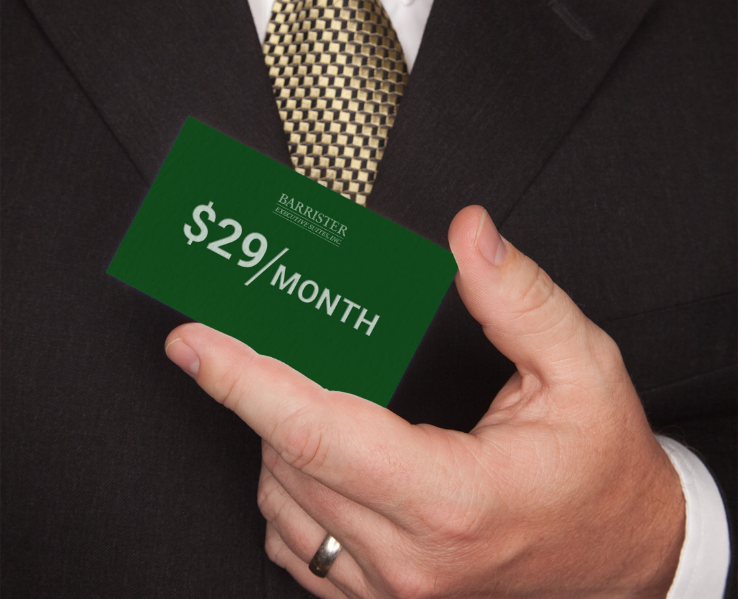 Barrister Suites Office Lease A person in a dark suit and patterned tie holds a green card that reads $29/MONTH and BARRISTER in white text.