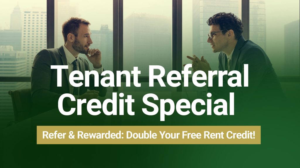 Barrister Suites Office Lease Two men in business suits sit at a table in a modern office with city views, talking. Text on the image says, Tenant Referral Credit Special. Refer & Rewarded: Double Your Free Rent Credit!.