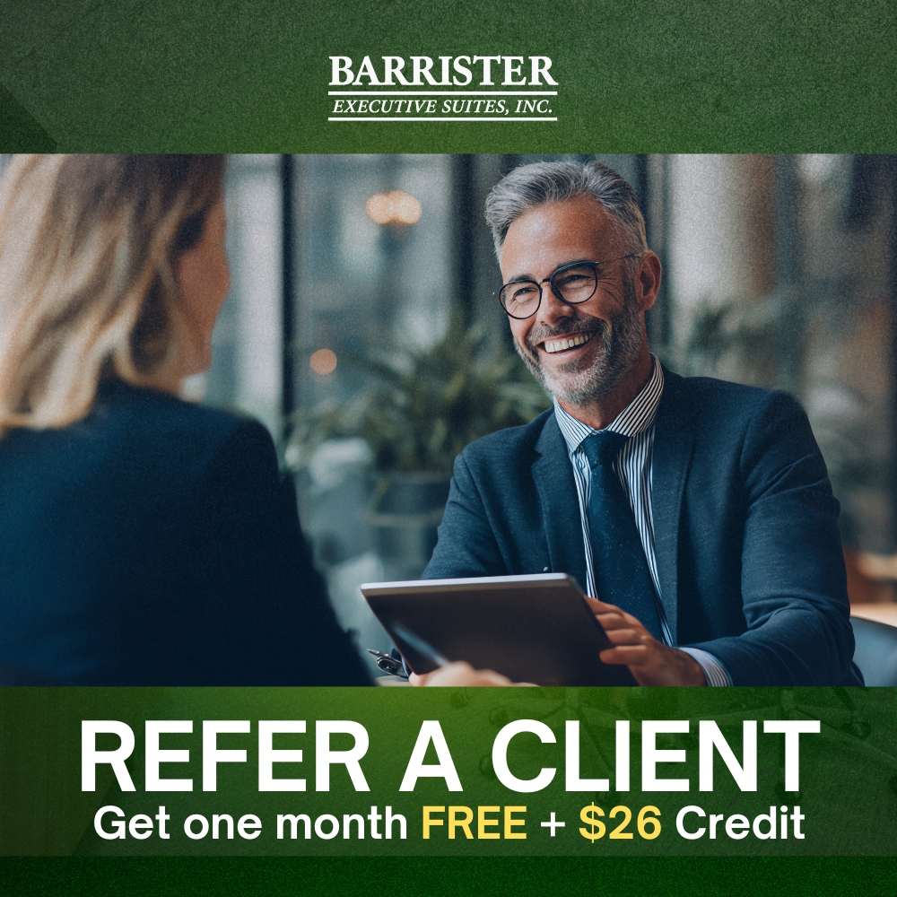 Barrister Suites Office Lease Two business professionals sit across from each other, smiling and talking. Text reads: “Barrister Executive Suites, Inc. Refer a client. Get one month free + $26 credit.”.