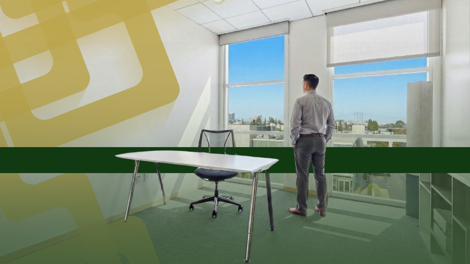 Barrister Suites Office Lease A man stands by a window in a modern office, looking outside. An empty desk and chair are in the foreground, with city buildings visible through the large windows. Abstract yellow and green graphics overlay the image.