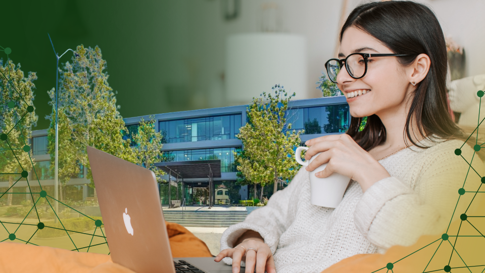 Barrister Suites Office Lease A smiling woman with glasses holds a mug and uses a laptop. In the background, there is a modern building with trees, and green digital network graphics overlay the image.